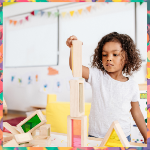 A creative young girl building with blocks